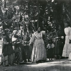 Group of Romani women and children in the Alhambra Forest in Granada, Andalusia